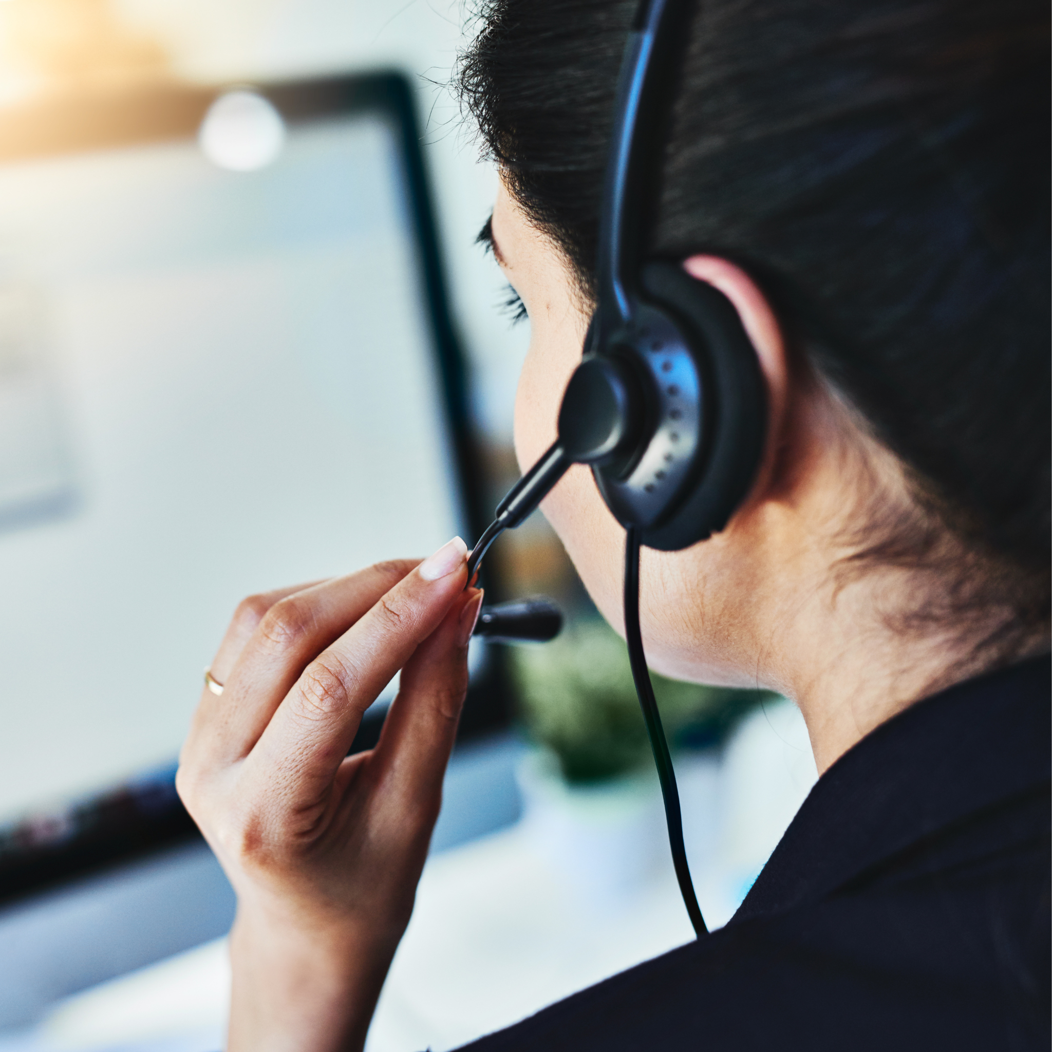 Customer support representative wearing a headset